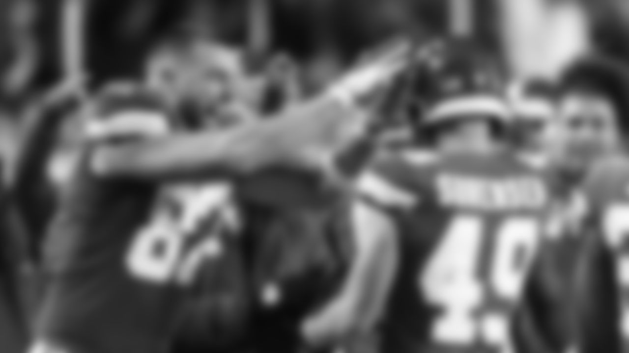 Kansas City Chiefs tight end Travis Kelce (87) celebrates the interception of defensive back Daniel Sorensen (49) during an NFL football game against the Denver Broncos, Sunday, December 5, 2021 in Kansas City.
