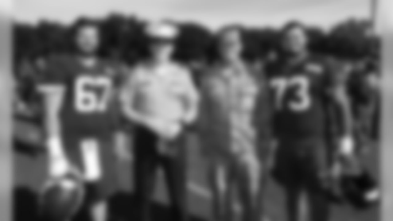 Military members with Kansas City Chiefs Center Jimmy Murray (67) and Kansas City Chiefs Offensive Lineman Nick Allegretti (73) during a 2019 Training Camp practice at Missouri Western State University in St. Joseph, MO