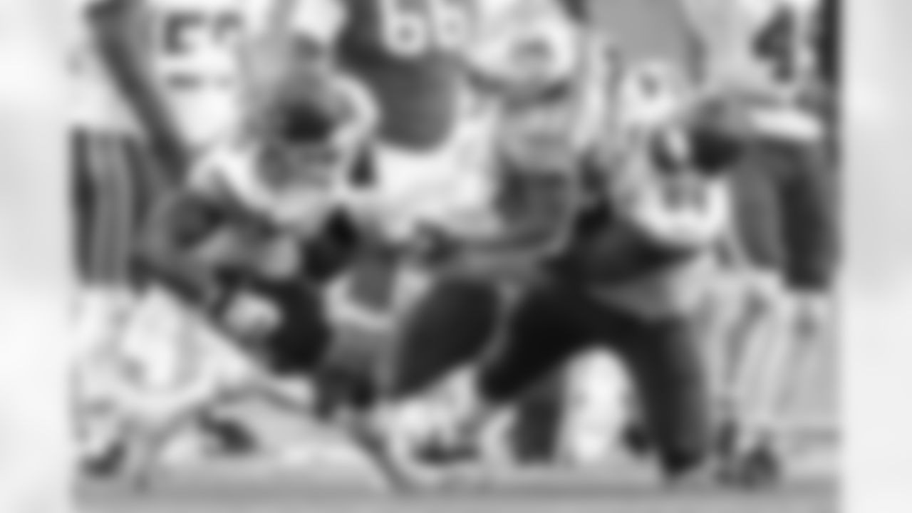 Kansas City Chiefs Defensive Tackle Mike Pennel (64) makes a tackle of Running Back DeAndre Washington (31) during to an NFL Football game against the Miami Dolphins, Sunday December 13, 2020 in Miami Gardens.