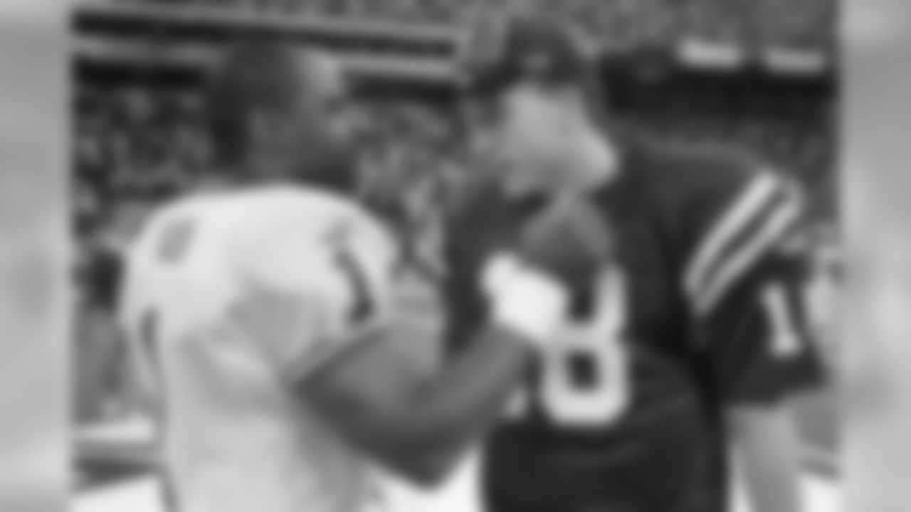 Colts QB Peyton Manning is congratulated by Chiefs QB Warren Moon following their game in Indianapolis on November 7, 1999. The Chiefs lost 17-25.