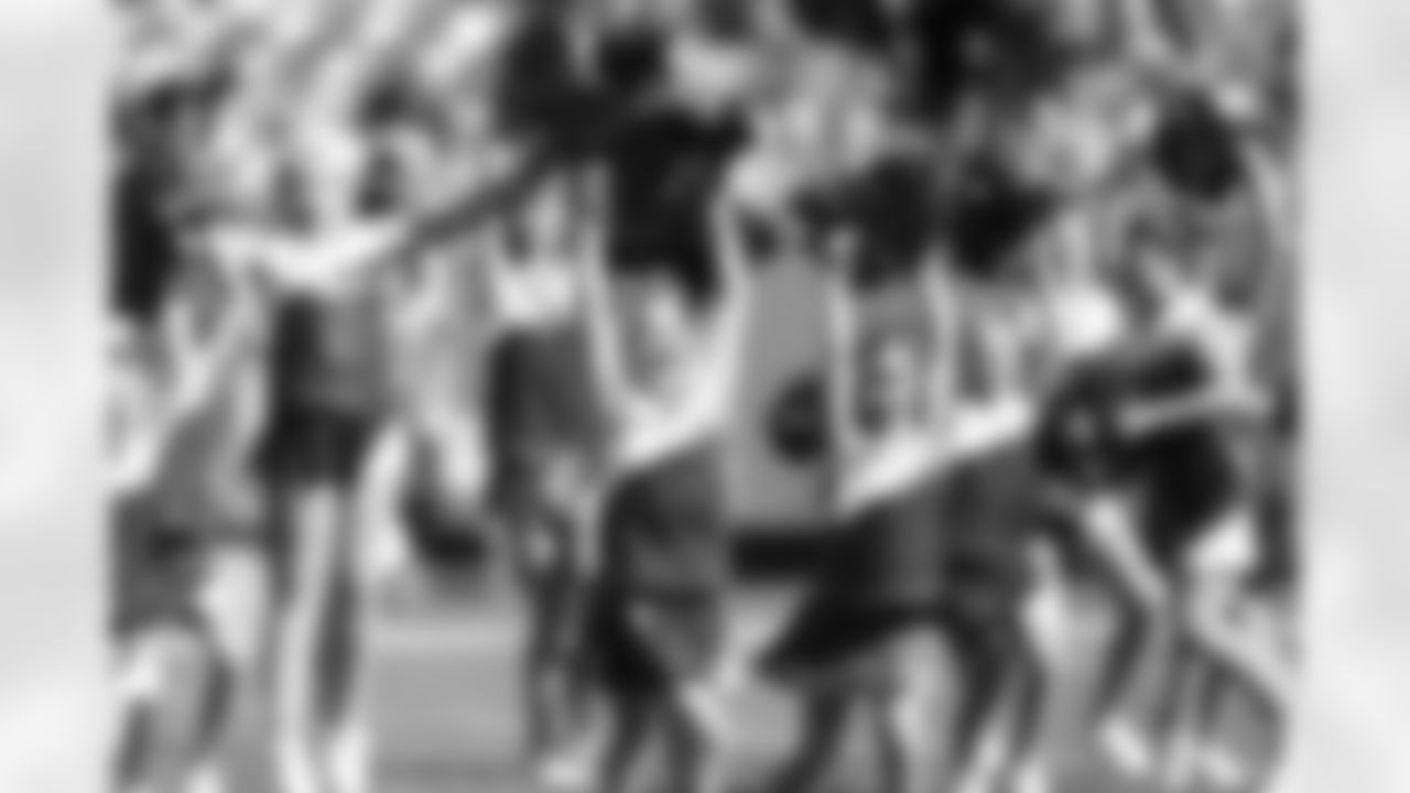 Kansas City Chiefs Cheerleaders and Junior Chiefs Cheerleaders Perform at Halftime during the Chiefs vs Rams game