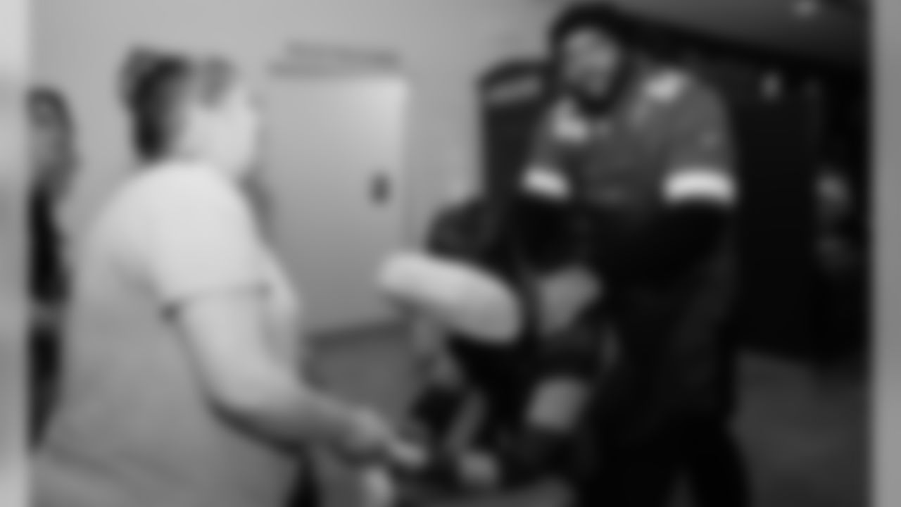 Chiefs players Damien Wilson and Mike Pennel join Kansas City Royals players Alex Gordon and Bubba Starling at the Community Services League BlendWell Community Cafe to pamper single mothers for a holiday spa day.