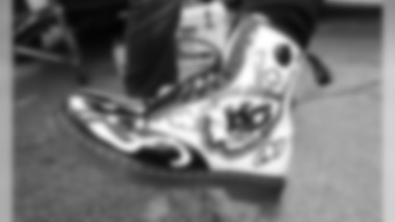 A Chiefs fan wears custom Dr. Martin shoes prior to the game between the Kansas City Chiefs and the Los Angeles Chargers at Arrowhead Stadium.