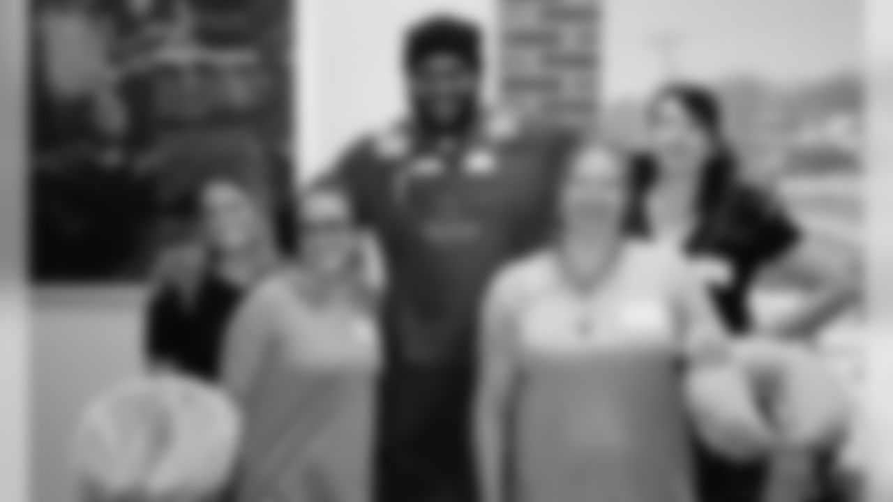 Chiefs players Damien Wilson and Mike Pennel join Kansas City Royals players Alex Gordon and Bubba Starling at the Community Services League BlendWell Community Cafe to pamper single mothers for a holiday spa day.