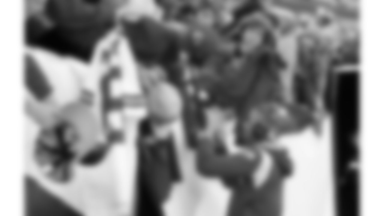 Kansas City Chiefs corner back Trent McDuffie (21) signs autographs prior to an NFL football game against the Denver Broncos, Sunday, December 11, 2022 in Denver.