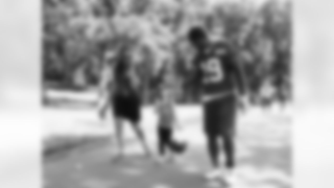Wr Kyle Williams walks with a lucky fan.