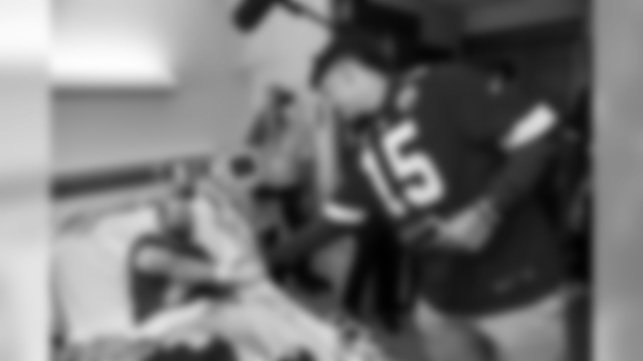 The Chiefs Community Caring Team, led by the Chiefs quarterbacks, visit The University of Kansas Health System to share hope and sign autographs for those fighting medical battles, including those in the oncology unit.