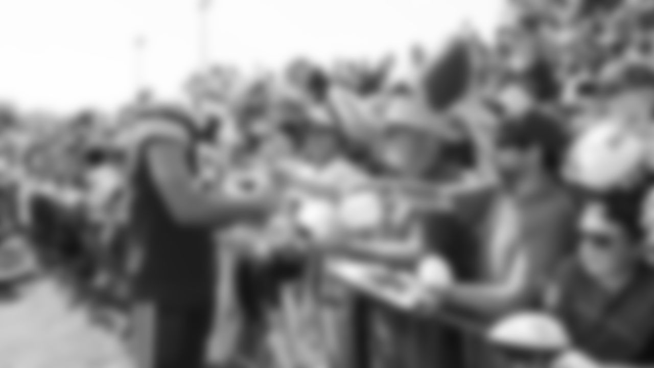 Kansas City Chiefs tight end Travis Kelce (87) signs autographs after training camp at Missouri Western State University.