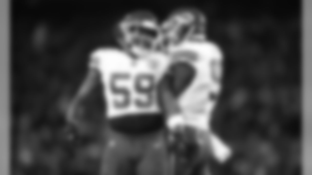 Kansas City Chiefs Linebacker Reggie Ragland (59) and Defensive Tackle Chris Jones (95) during the game between the Kansas City Chiefs and the New England Patriots on December 8, 2019.