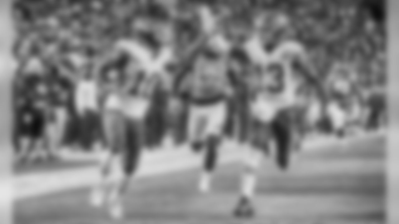 Kansas City Chiefs wide receiver De'Anthony Thomas (13) high fives Kansas City Chiefs wide receiver Tyreek Hill (10) as he returns a kickoff for a touchdown during the game against the Denver Broncos, Sunday, November 27, 2016, in Denver, Colorado.