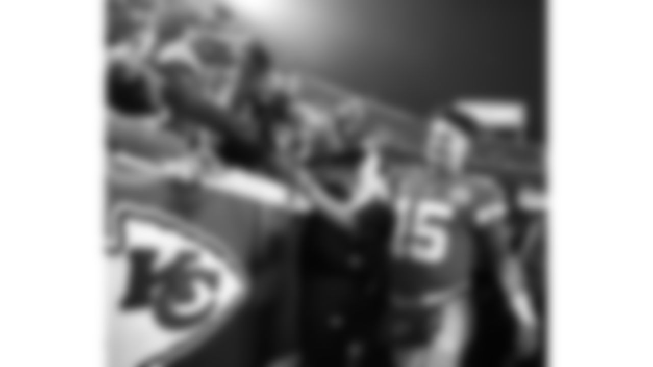 Kansas City Chiefs quarterback Patrick Mahomes (15) slaps fans hands after an NFL football game against the Jacksonville Jaguars, Saturday January 21, 2023 in Kansas City.
