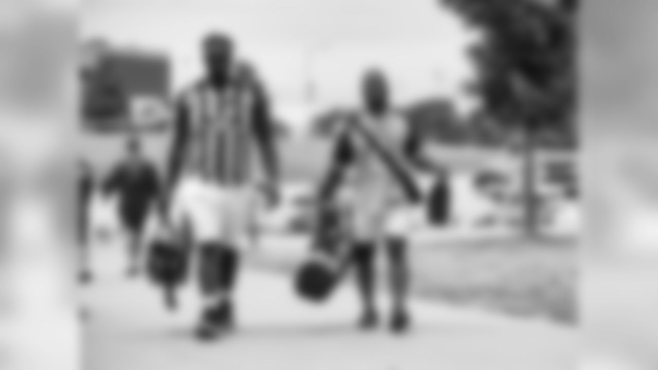 Veteren players arrive at training camp