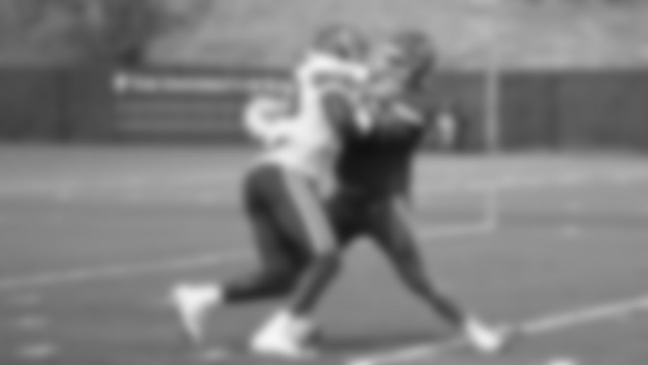 Kansas City Chiefs defensive end Joshua Kaindoh (59) and offensive guard Andrew Wylie (77) during practice at The University of Kansas Health System Training Complex.