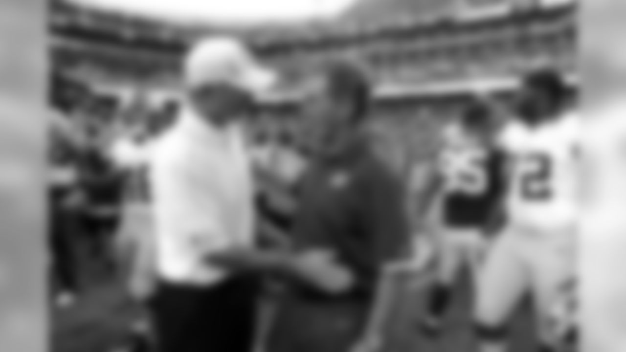 Indianapolis Colts coach Chuck Pagano, left, greets Washington Redskins coach Mike Shanahan after an NFL preseason football game Saturday, Aug. 25, 2012, in Landover, Md. The Redskins won 30-17. (AP Photo/Richard Lipski)