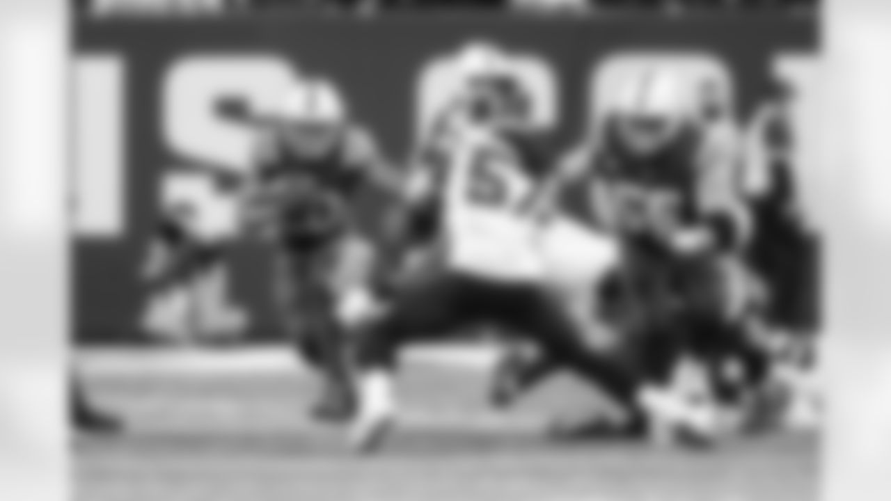 28 RB Jonathan Taylor, #56 C/G Quenton Nelson