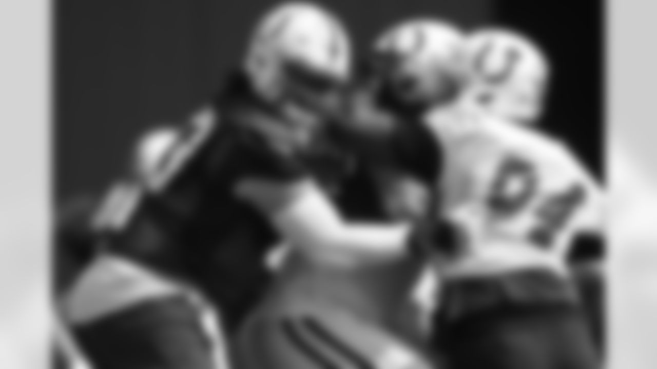 73 OT Dennis Kelly, #94 DT/DE Tyquan Lewis