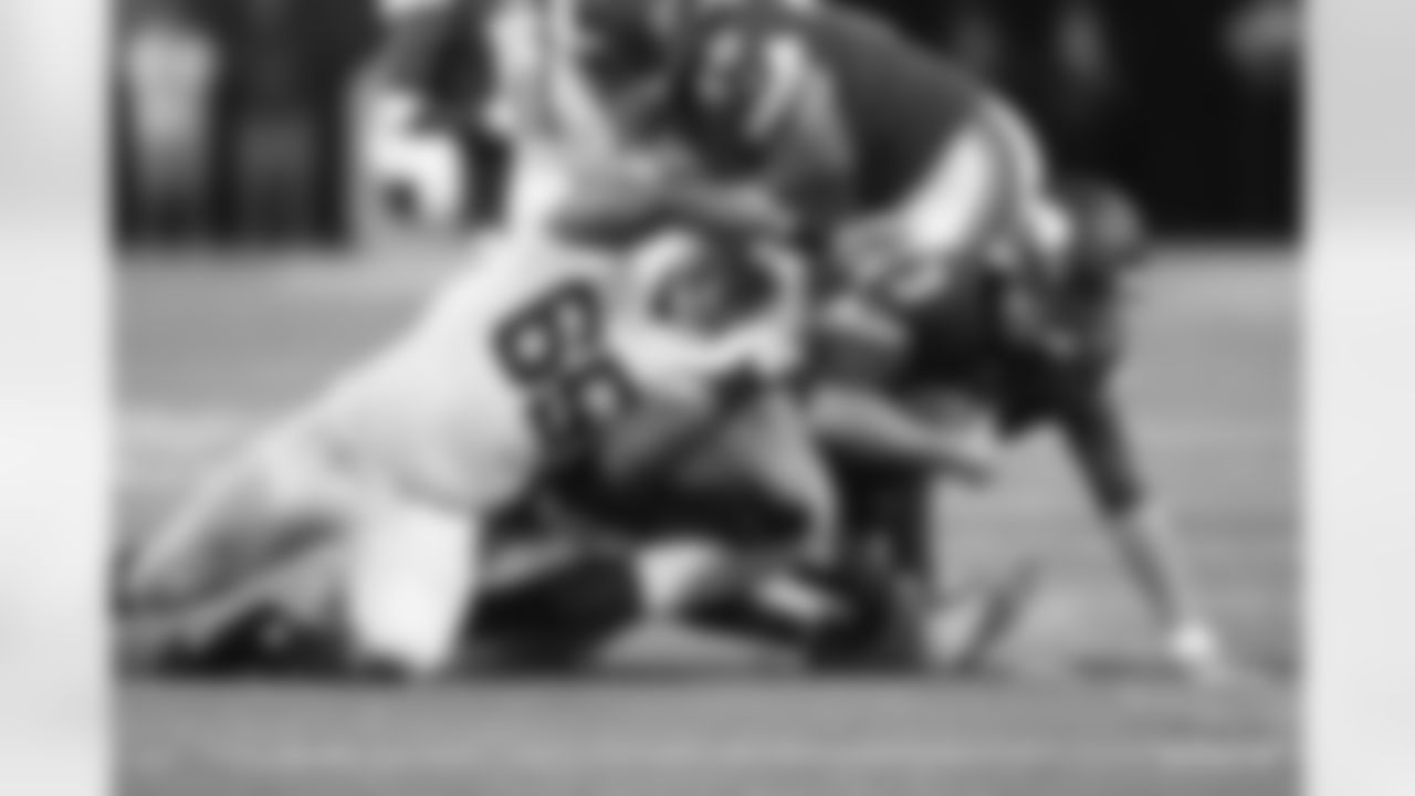 65 DT Andrew Brown, #97 DE Al-Quadin Muhammad\