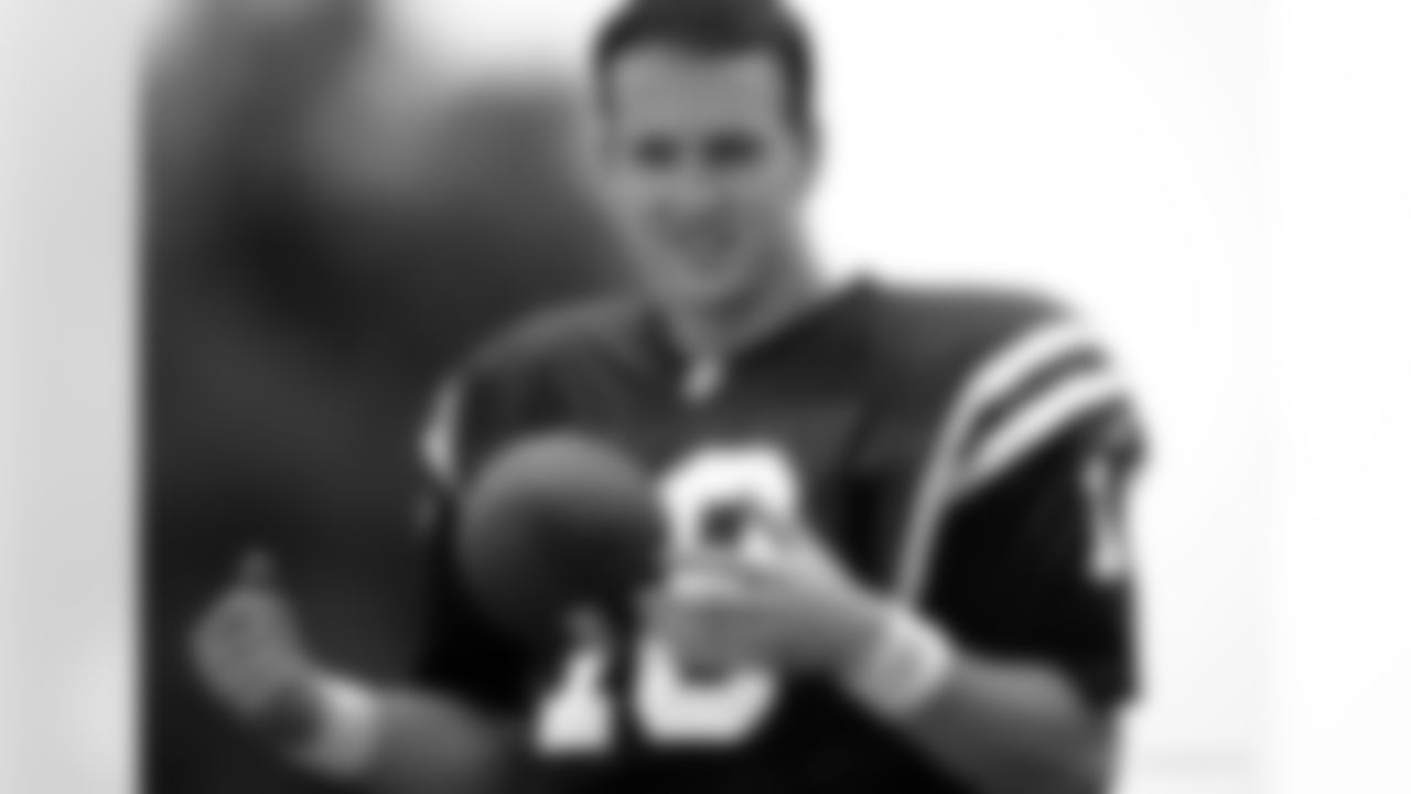 Quarterback Peyton Manning (18) of the Indianapolis Colts poses at training camp in 1998. (Al Messerschmidt via AP)