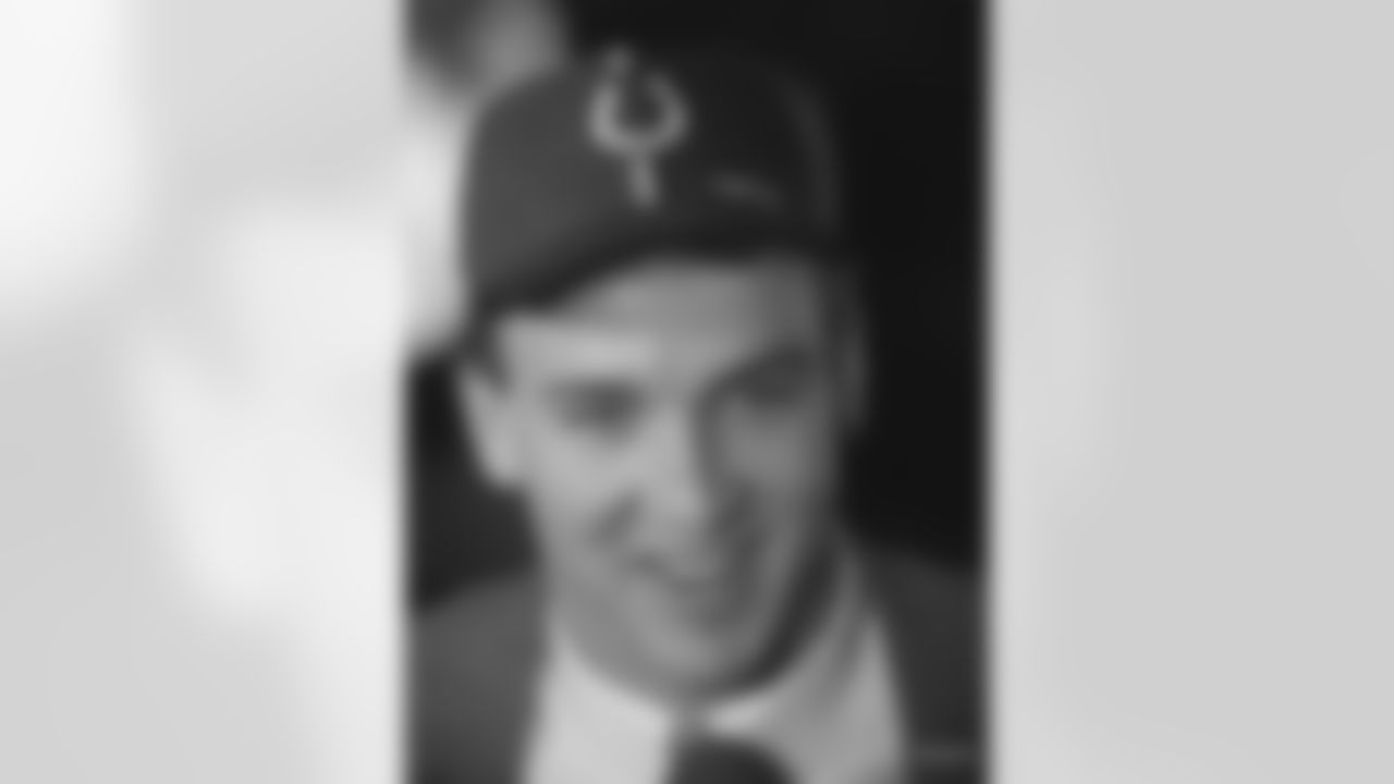 Quarterback Peyton Manning, of Tennessee, wears an Indianapolis Colts cap during an interview after the Colts selected Manning as the number one pick overall in the NFL draft Saturday, April 18, 1998, in New York. (AP Photo/Adam Nadel)