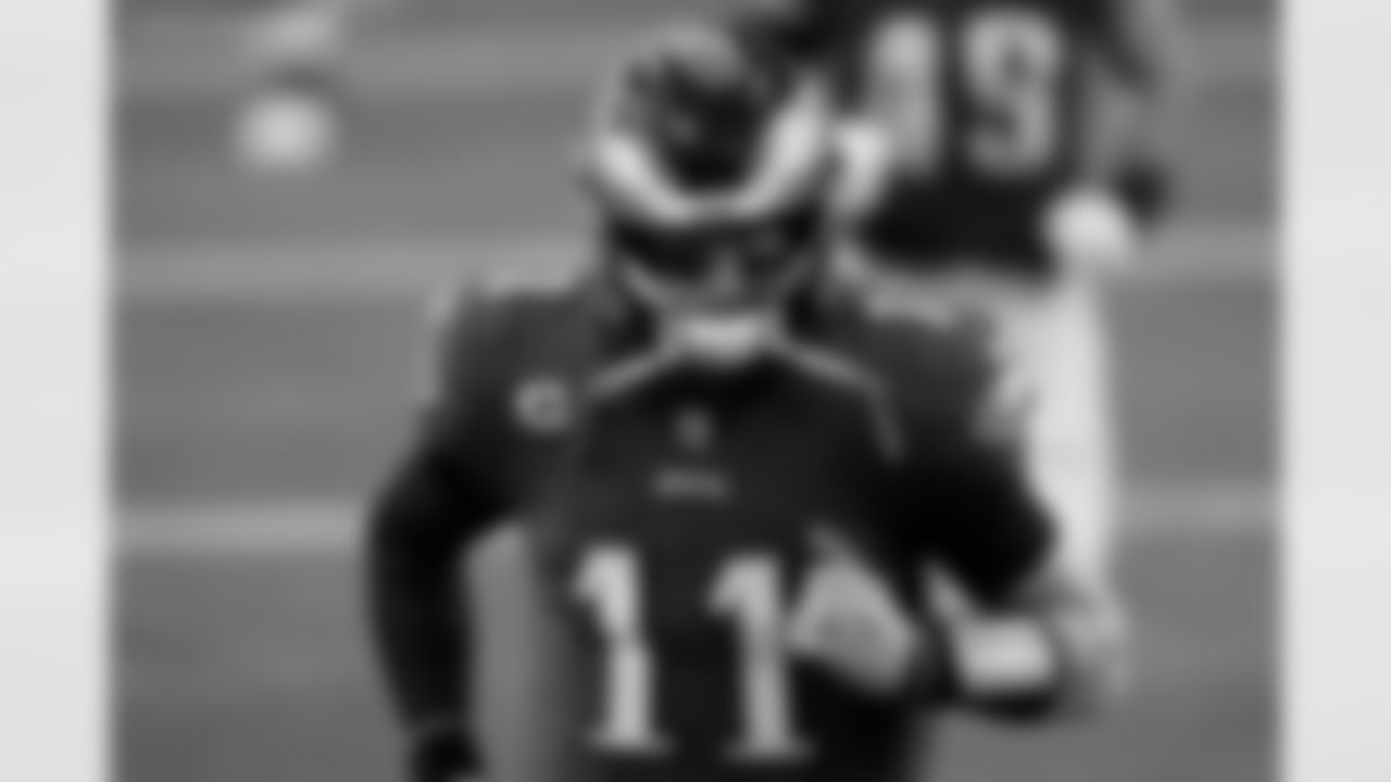 Philadelphia Eagles quarterback Carson Wentz (11) runs off of the field prior to an NFL game against the Dallas Cowboys, Sunday, Dec. 27, 2020, in Arlington, Texas. The Cowboys beat the Eagles 37-17. (Cooper Neill via AP)