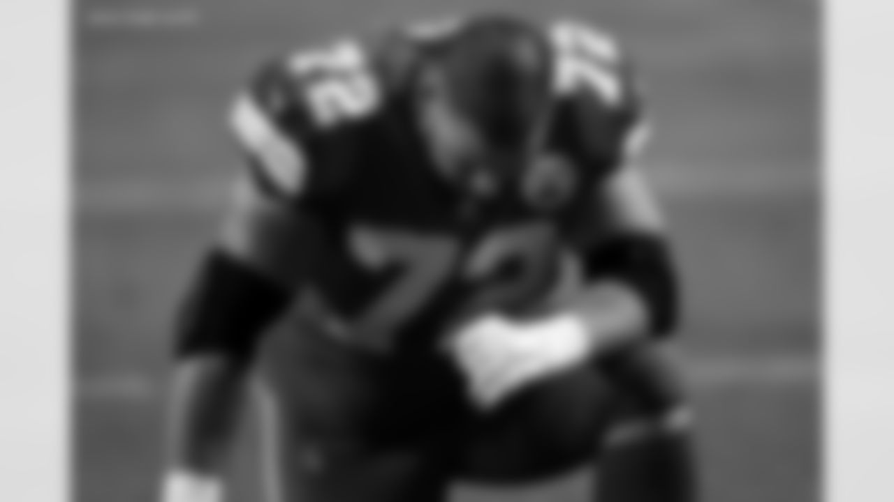 Kansas City Chiefs offensive tackle Eric Fisher (72) kneels in the end zone prior to an NFL football game against the Denver Broncos, Sunday, Dec. 6, 2020, in Kansas City, MO. The Chiefs won 22-16. (Aaron Doster via AP)