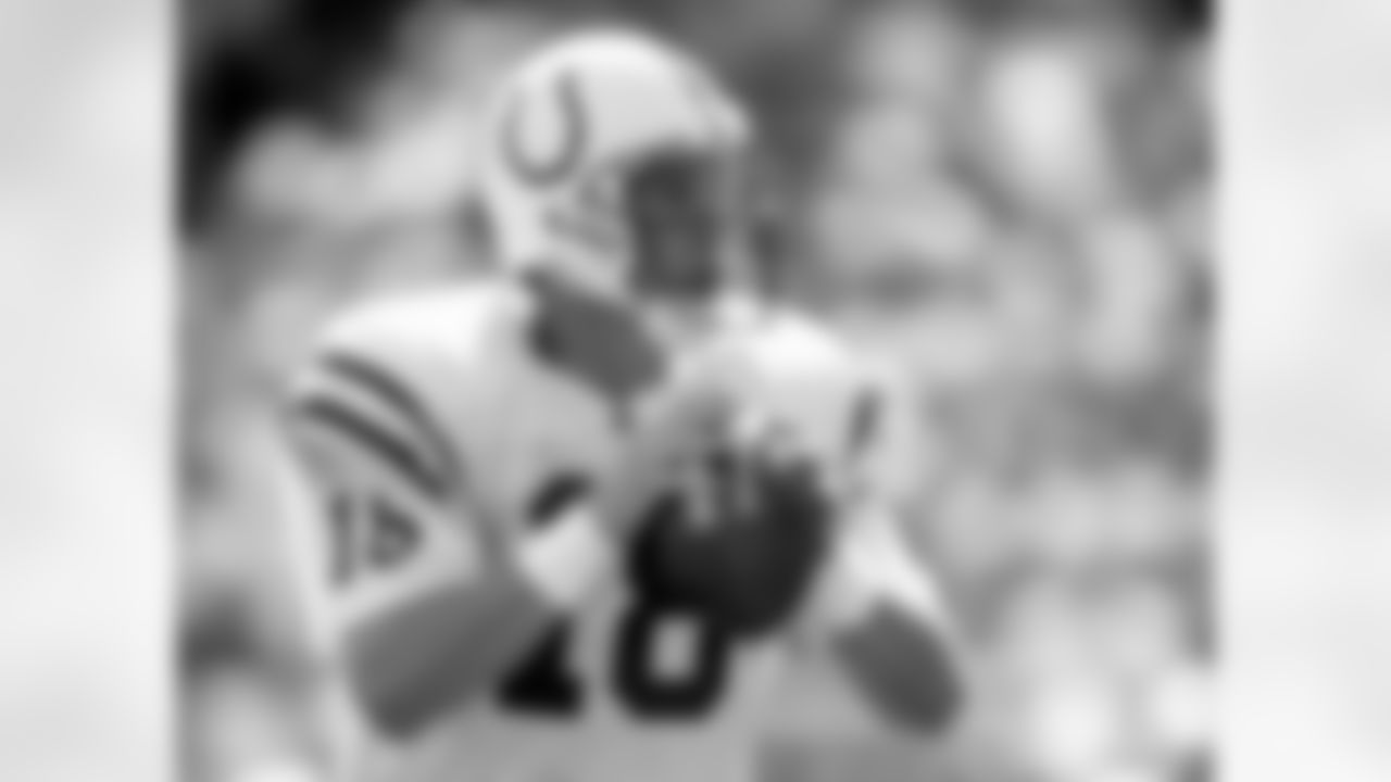 Indianapolis Colts quarterback Peyton Manning (18) gets set to throw a pass during an NFL game against the New York Jets Sept. 9, 2001, in East Rutherford, N.J. The Colts defeated the Jets 45–24. (Allen Kee via AP)