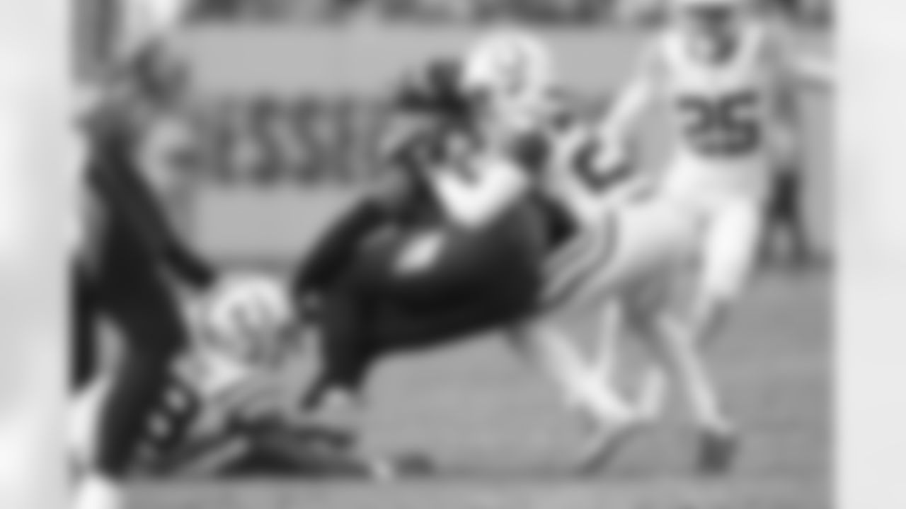23 CB Kenny Moore II, #58 LB Bobby Okereke