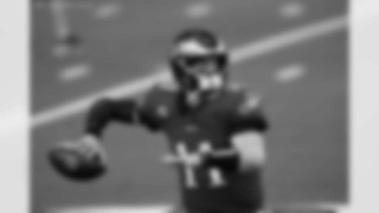 Philadelphia Eagles quarterback Carson Wentz (11) throws a warm up pass during an NFL football game against the Dallas Cowboys, Sunday, Dec. 27, 2020 in Arlington, Tex. The Cowboys won the game 37-17. (Paul Jasienski via AP)