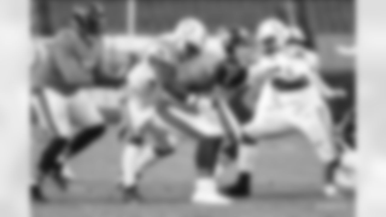 50 DE Justin Houston, #96 DT/DE Denico Autry