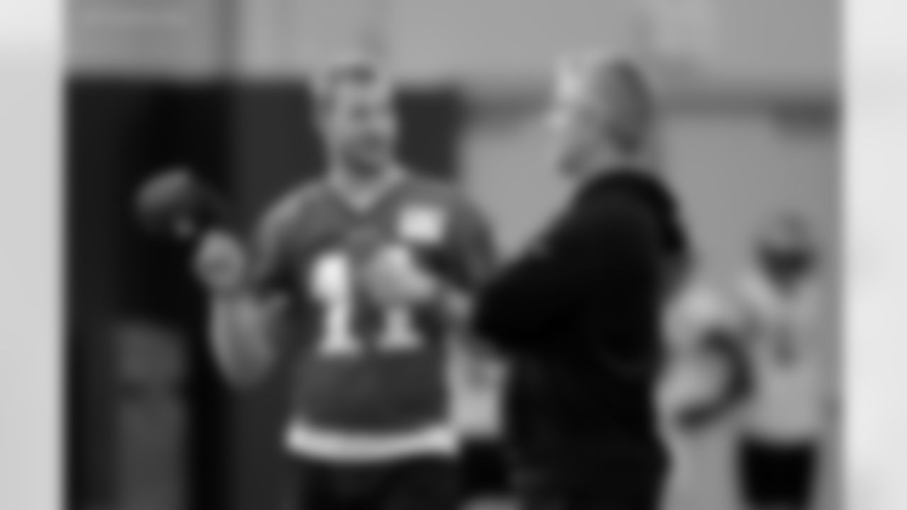 Injures Philadelphia Eagles quarterback Carson Wentz (11) talks with offensive coordinator Frank Reich, right, during a practice for the NFL Super Bowl 52 football game Thursday, Feb. 1, 2018, in Minneapolis. Philadelphia is scheduled to face the New England Patriots Sunday. (AP Photo/Eric Gay)