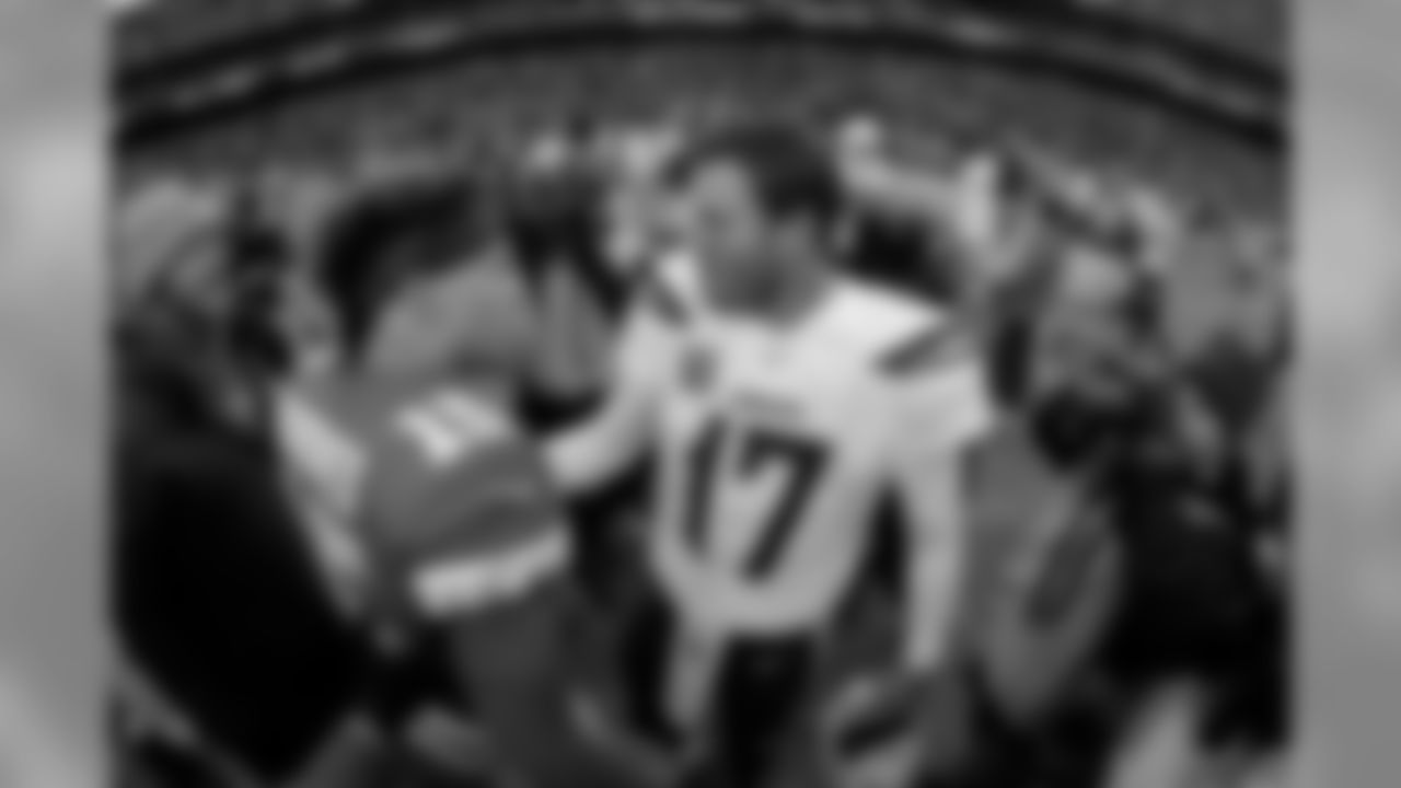 Kansas City Chiefs quarterback Patrick Mahomes (15) and Los Angeles Chargers quarterback Philip Rivers (17) talk after their NFL football game Sunday, Dec. 29, 2019, in Kansas City, Mo. The Chiefs won 31-21. (AP Photo/Charlie Riedel)