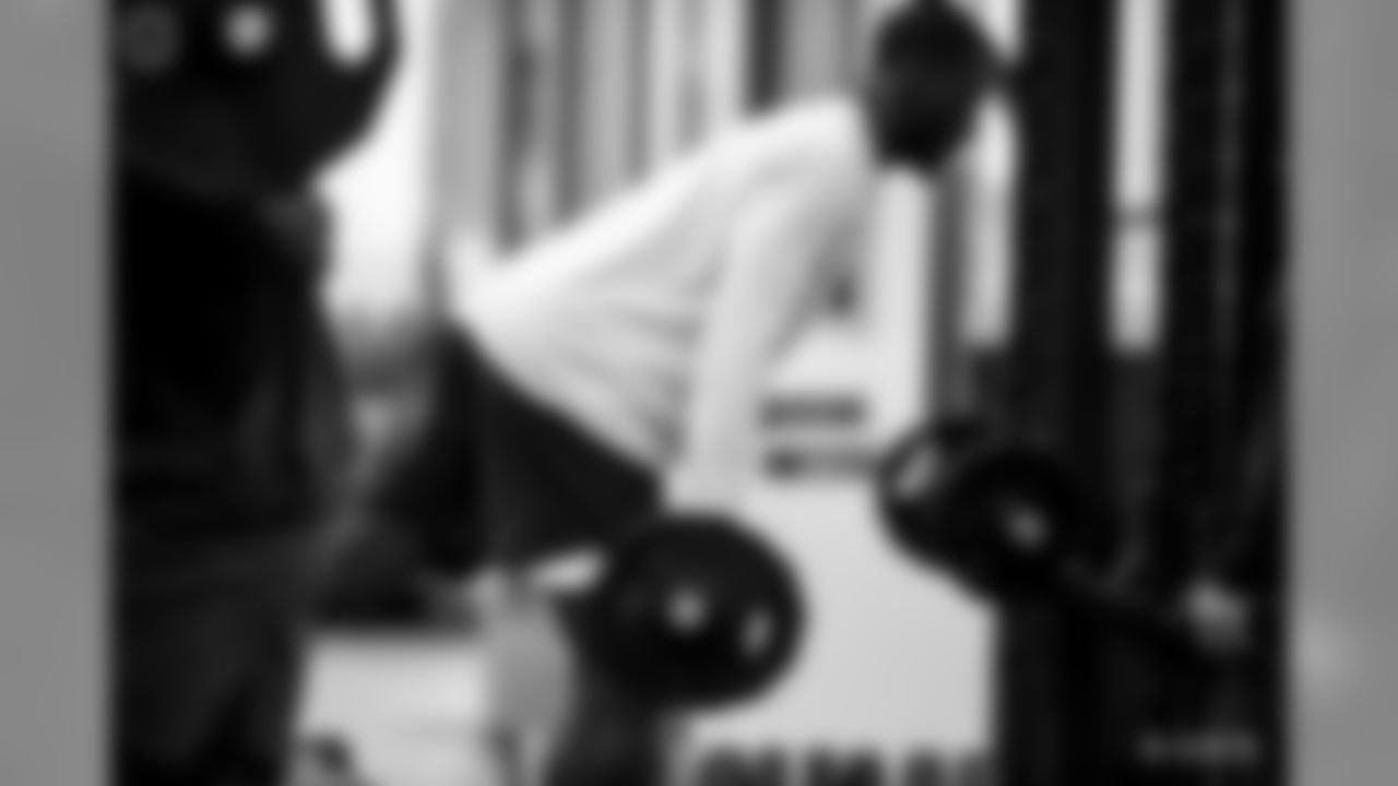 A candid look at the skill position groups in the weight room during Phase I of the offseason workouts.