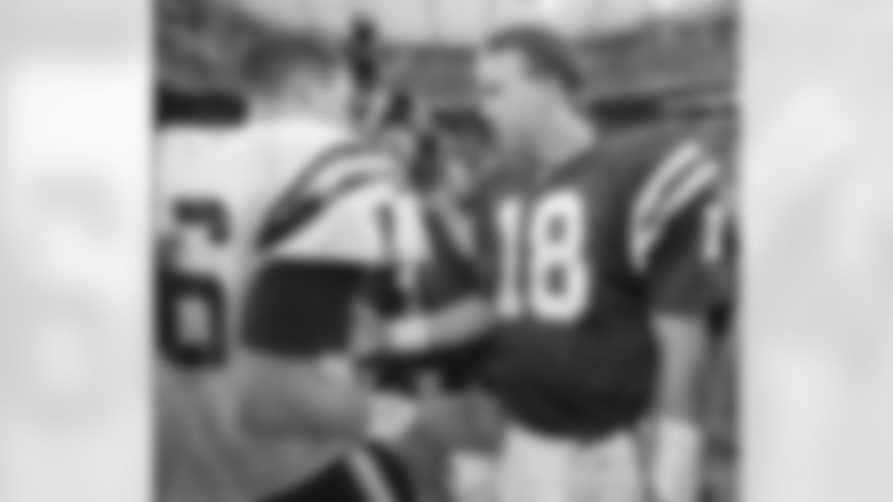 Indianapolis Colts quarterback Peyton Manning, right, meets with San Diego Chargers quarterback Ryan Leaf after the Colts defeated the Charges 17-12 in Indianapolis, Sunday, Oct. 4, 1998. The win was Manning's first win in the NFL. (AP Photo/Michael Conroy)