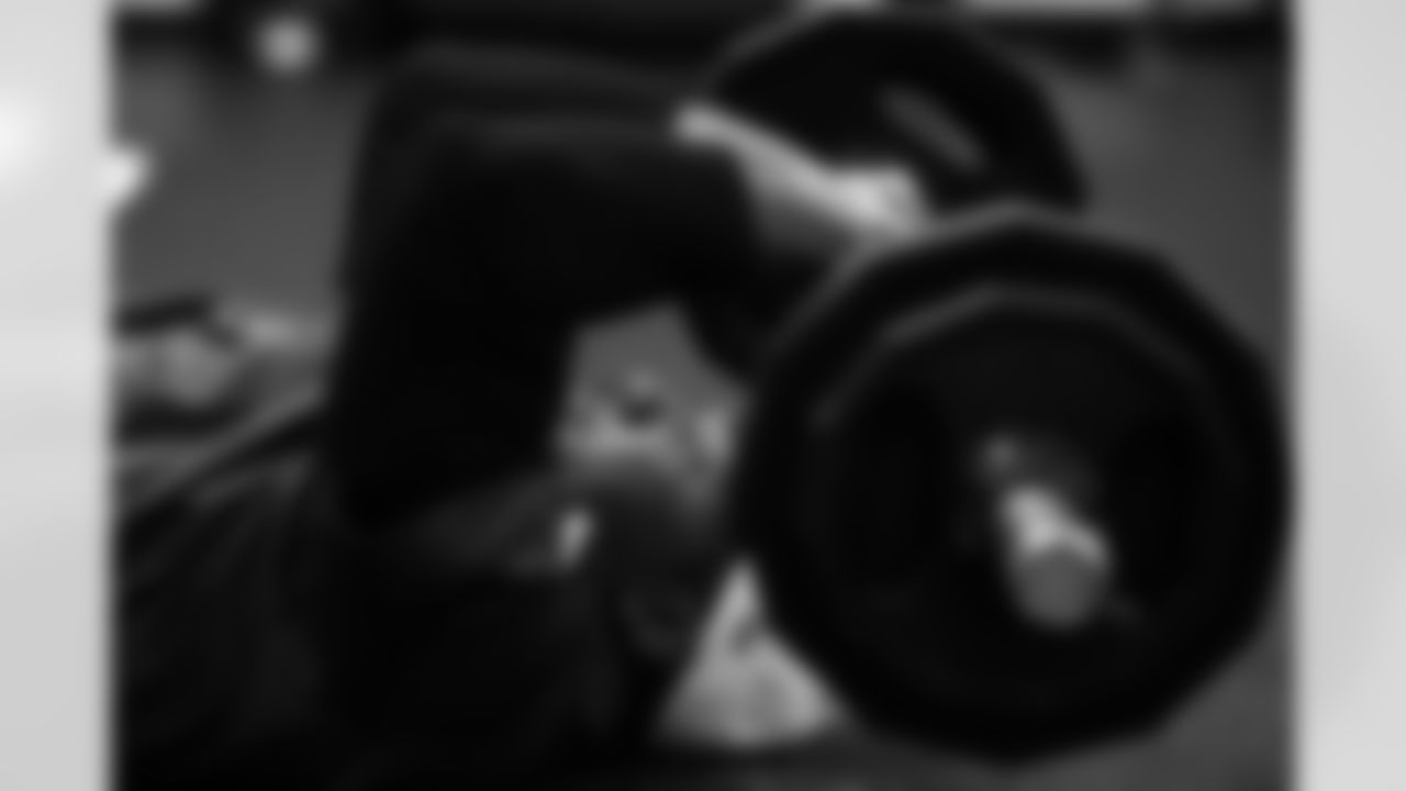 94 DT/DE Tyquan Lewis,
Players train in the weight room during Phase III of offseason workouts.