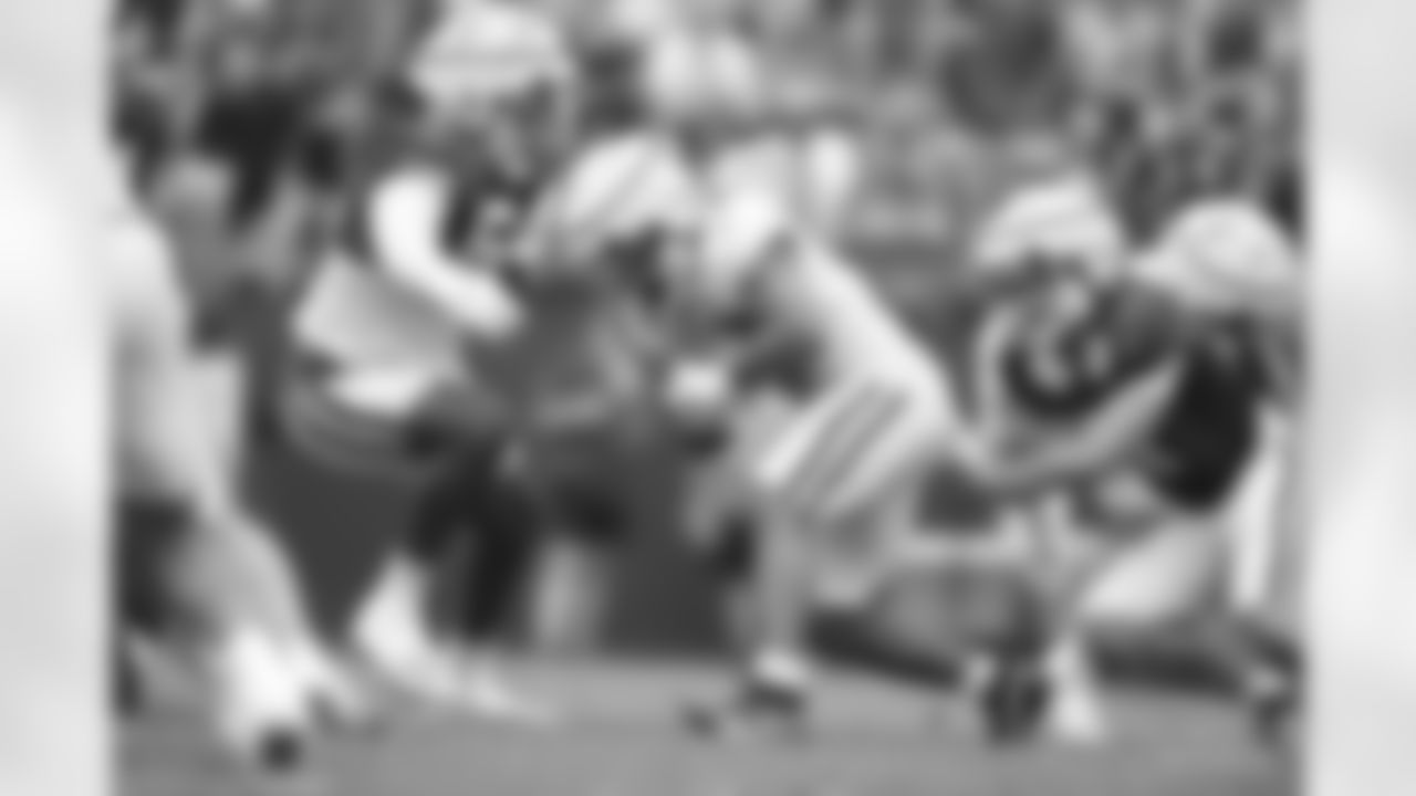 54 DE Dayo Odeyingbo, #42 RB CJ Verdell