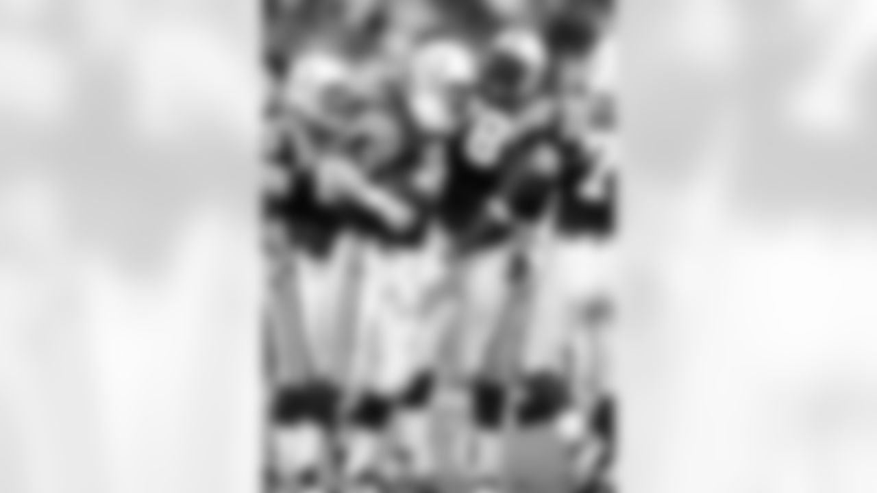 Indianapolis Colts quarterback Peyton Manning (18) celebrate with teammates during an NFL game against the Miami Dolphins Dec. 17, 2000, in Miami Gardens, Fla. The Colts defeated the Dolphins 20–13. (Allen Kee via AP)