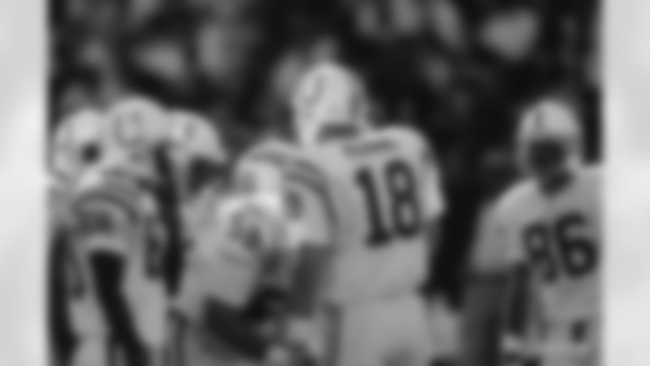 Indianapolis Colts quarterback Peyton Manning (18) huddles with his teammates during an NFL game against the San Francisco 49ers in San Francisco, on October 18, 1998. The 49ers defeated the Colts 34-31. (AP Photo/Kevin Terrell)
