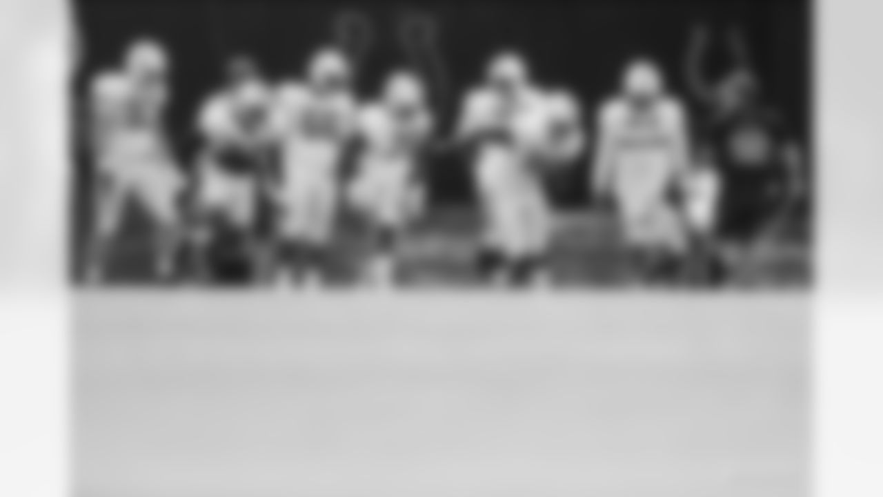 97 DE Al-Quadin Muhammad, #90 DT Grover Stewart