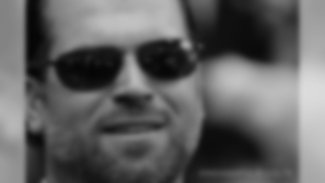 I like this photo because although it is a simple tight shot of our general manager, Ryan Grigson, you can see the field through his sunglasses making it more complex.