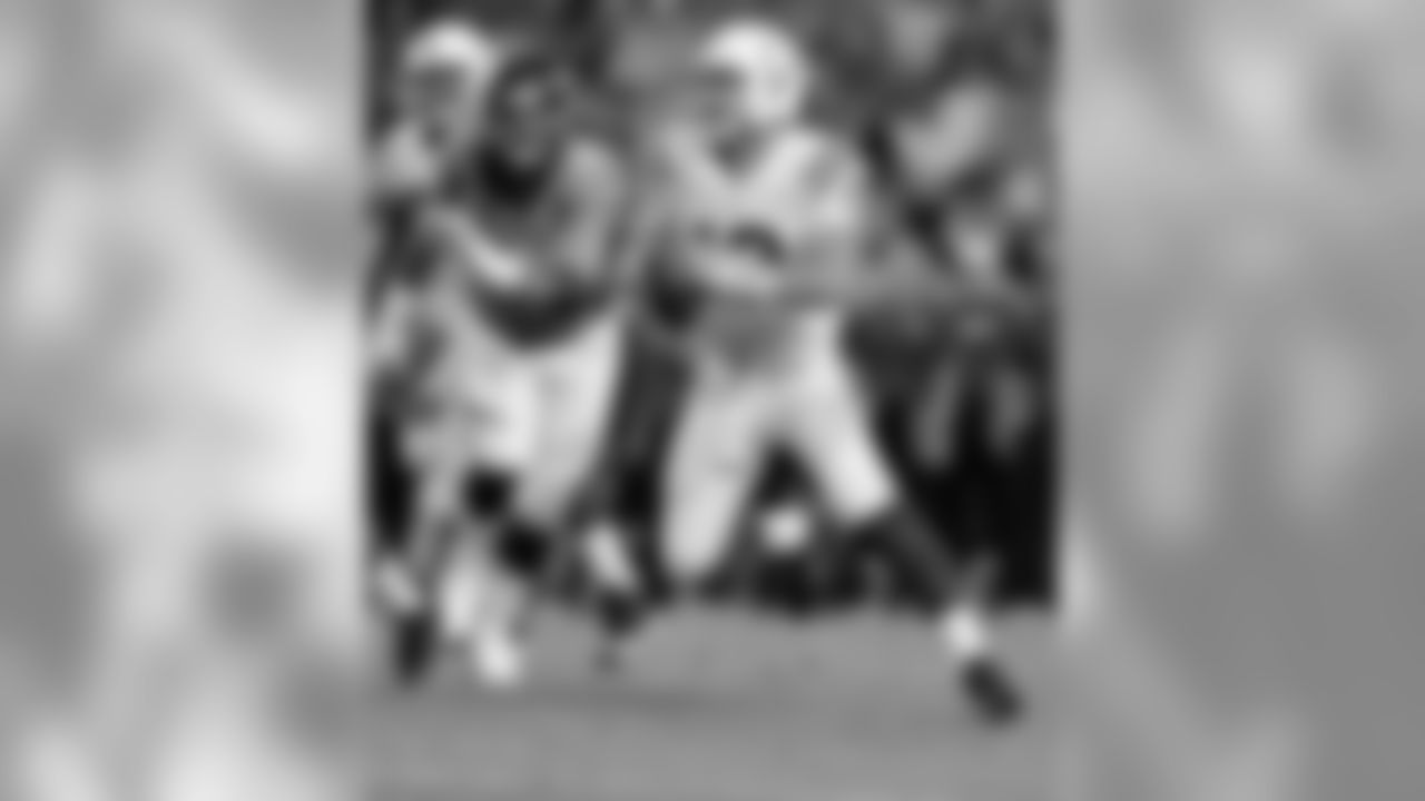 Indianapolis Colts quarterback Andrew Luck (12) looks to throw against the Denver Broncos during the second half of an NFL football game, Sunday, Sept. 7, 2014, in Denver. (AP Photo/Jack Dempsey)