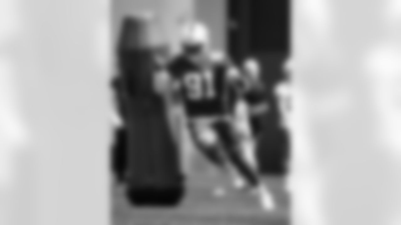91 DE Titus Leo,
Players train during OTAs of offseason workouts.