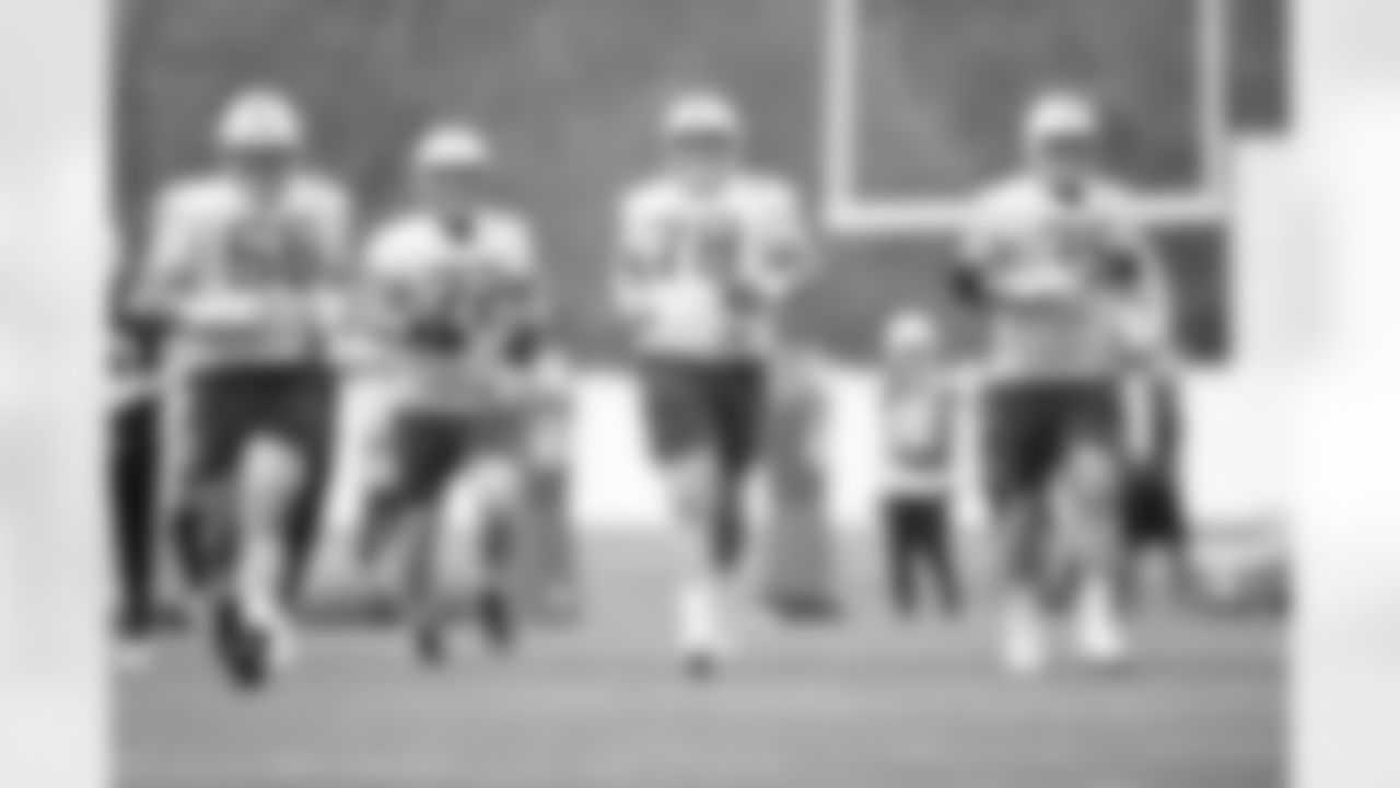 56 C/G Quenton Nelson, 72 T/G Braden Smith, 78 C Ryan Kelly, 75 G Will Fries
Players practice during voluntary minicamp offseason workouts.