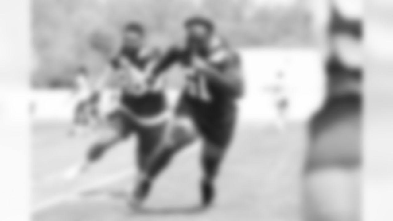 96 DT R.J. McIntosh, #51 DE Kwity Paye