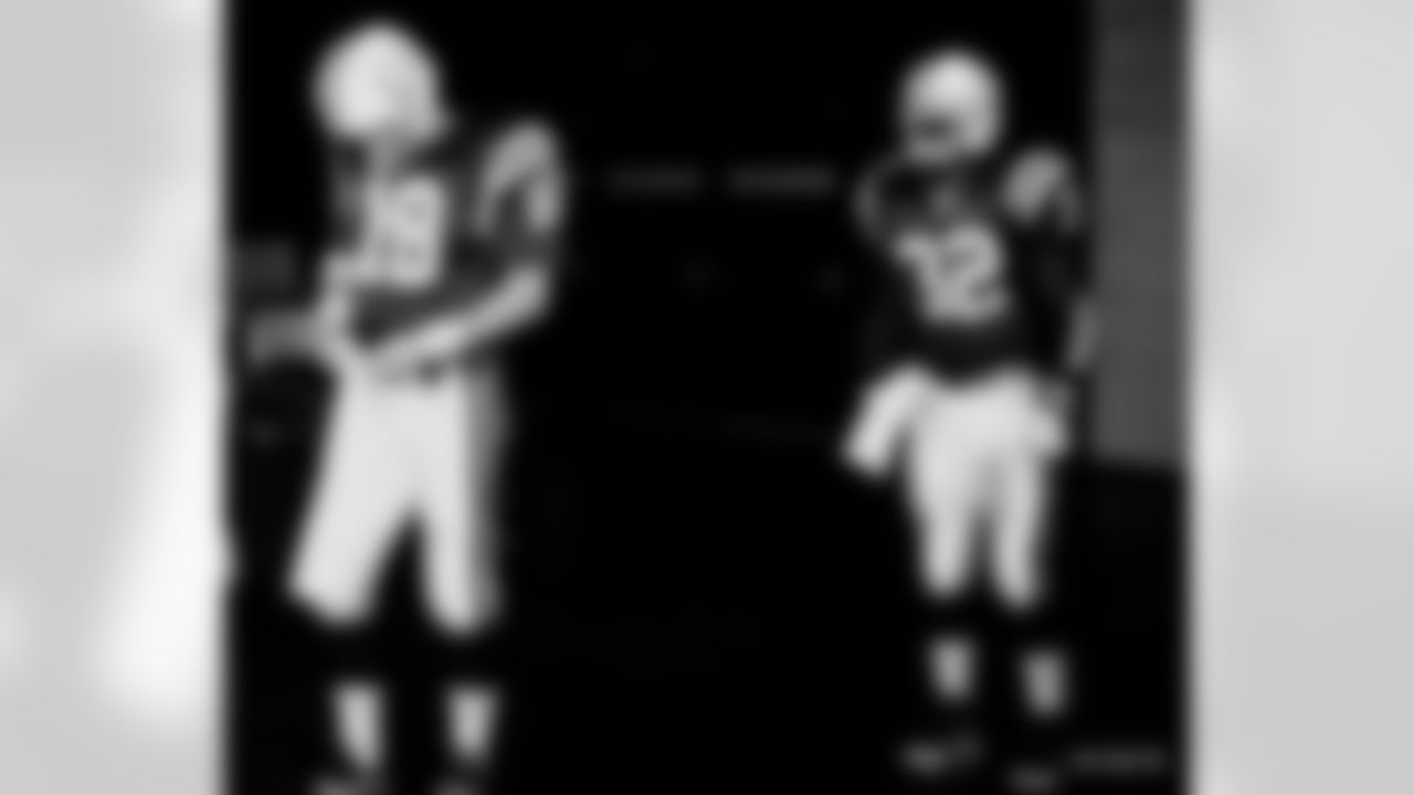 Indianapolis Colts quarterback Peyton Manning (18) and running back Edgerrin James (32) prepare to take the field before an NFL game against the Minnesota Vikings on December 24, 2000. The Colts defeated the Vikings 31-10 in Indianapolis, Indiana. (AP Photo/Kevin Terrell)