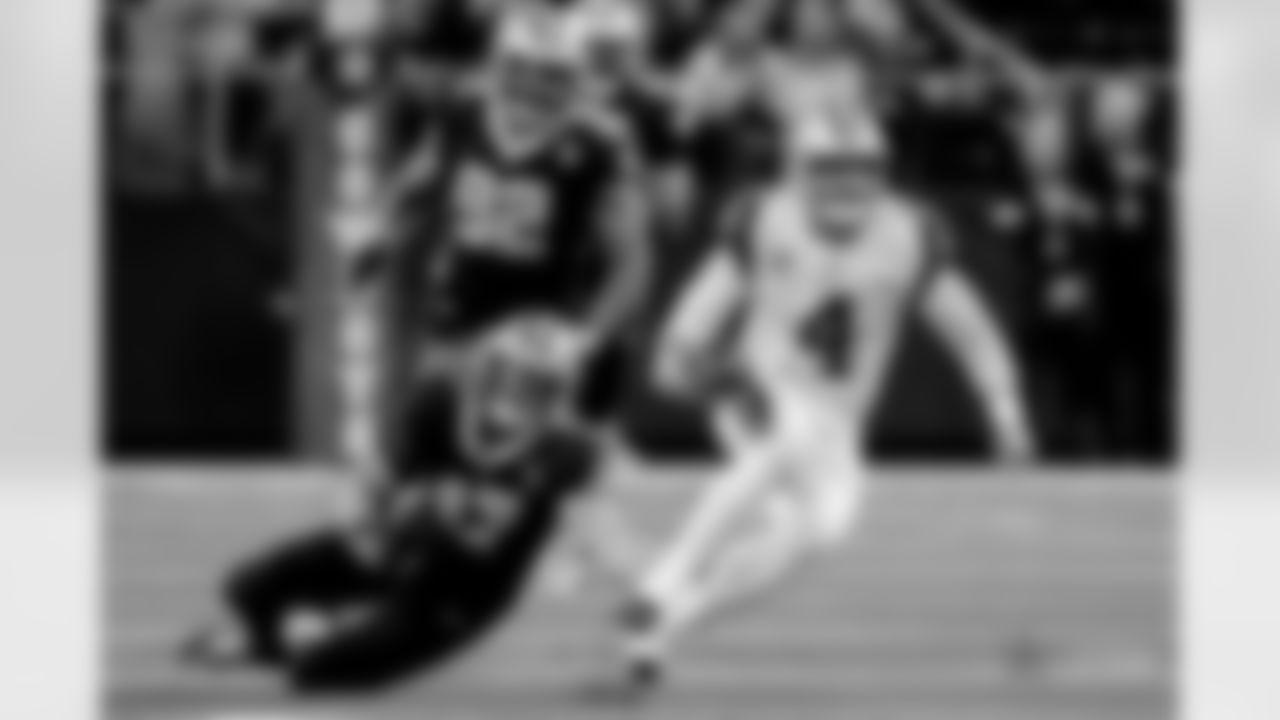Dallas Cowboys quarterback Dak Prescott (4) scramble against the New Orleans Saints in the first half of an NFL football game, in Arlington, Texas, Thursday, Nov. 29, 2018. (AP Photo/Ron Jenkins)