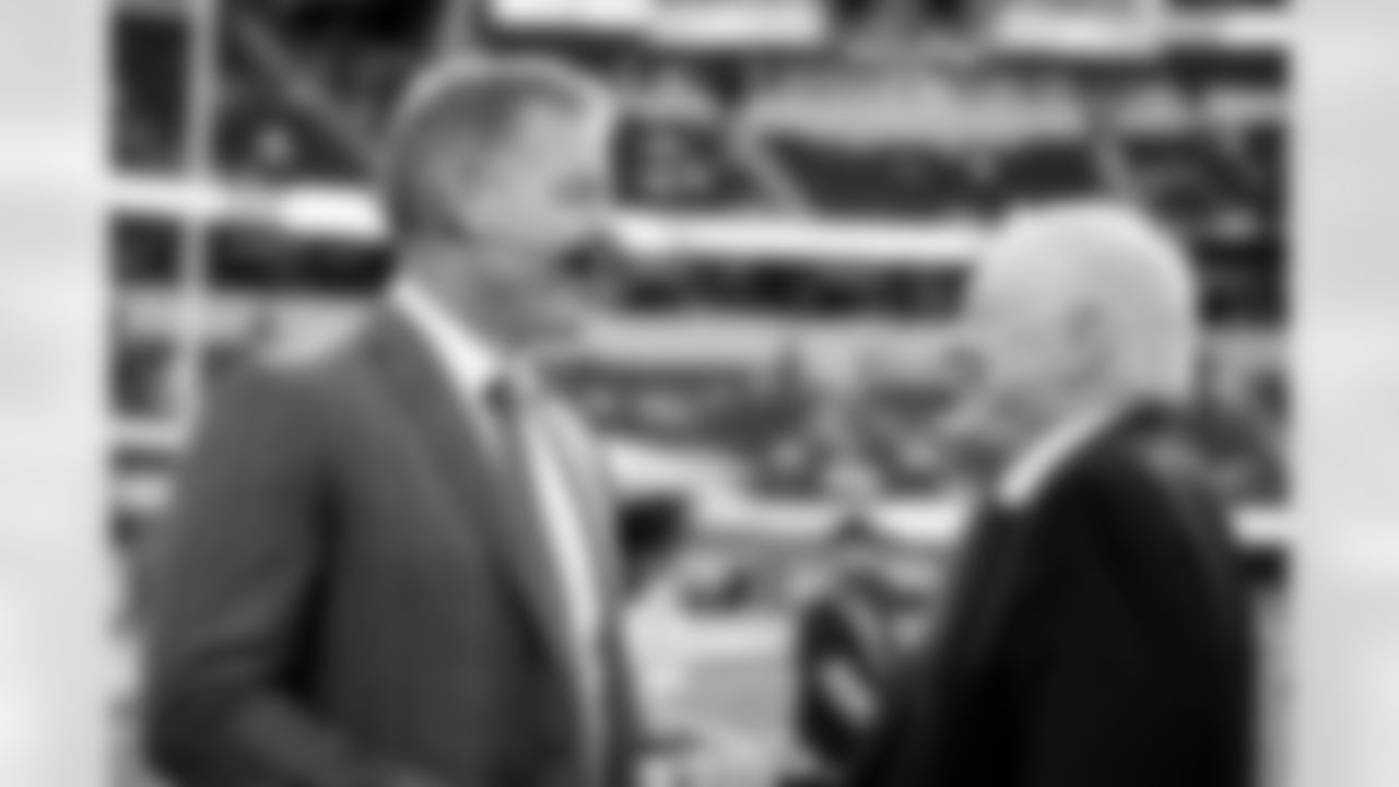 Former Dallas Cowboys quarterback Troy Aikman, left, and Cowboys owner Jerry Jones speak before an NFL football game against the Los Angeles Chargers, Monday, Oct. 16, 2023, in Inglewood, Calif. (AP Photo/Ashley Landis)