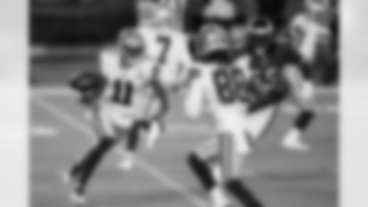 Dallas Cowboys' Cedrick Wilson (11) tosses the ball to CeeDee Lamb (88) during the first half of an NFL football game against the Philadelphia Eagles, Sunday, Nov. 1, 2020, in Philadelphia. (AP Photo/Derik Hamilton)