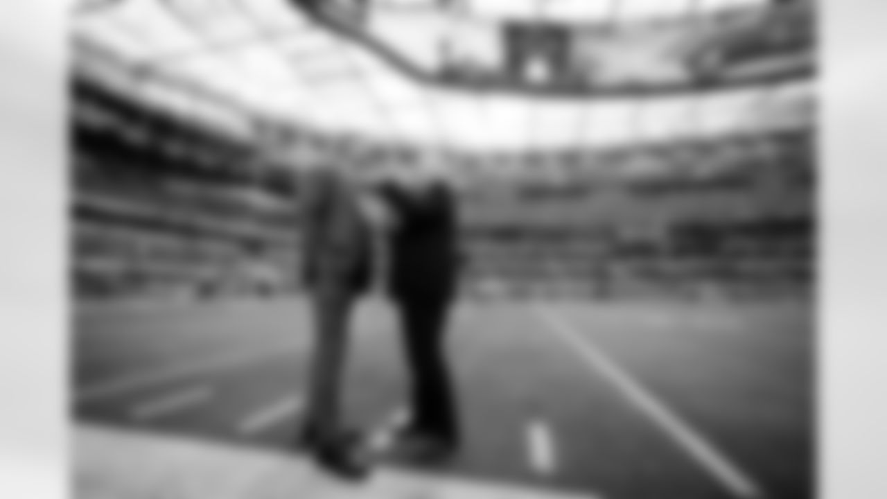 Former Dallas Cowboys quarterback Troy Aikman, left, and Cowboys owner Jerry Jones speak before an NFL football game against the Los Angeles Chargers, Monday, Oct. 16, 2023, in Inglewood, Calif. (AP Photo/Ashley Landis)
