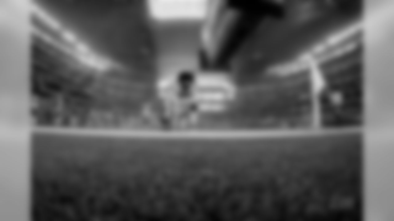 Dallas Cowboys running back Ezekiel Elliott (21) kneels in the end zone before an NFL football game against the Philadelphia Eagles, in Arlington, Texas, Sunday, Dec. 9, 2018. (AP Photo/Ron Jenkins)