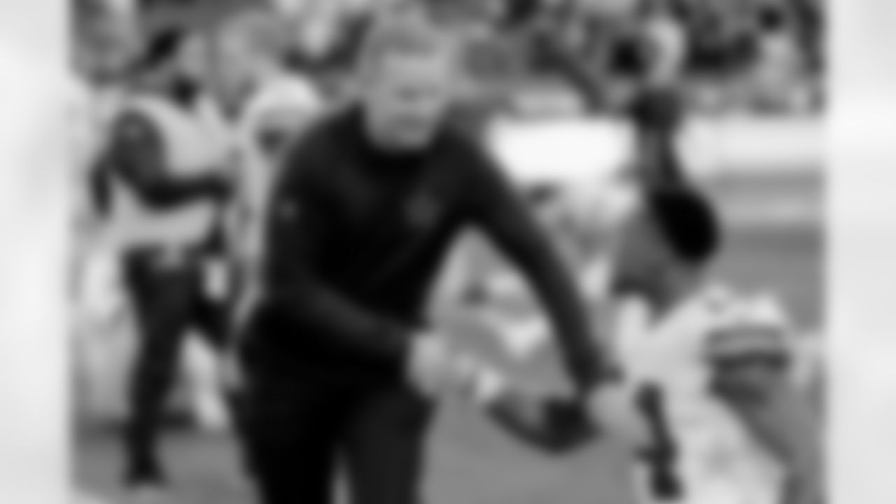 Dallas Cowboys head coach Jason Garrett greets a player before an NFL divisional football playoff game against the Los Angeles Rams Saturday, Jan. 12, 2019, in Los Angeles. (AP Photo/Marcio Jose Sanchez)